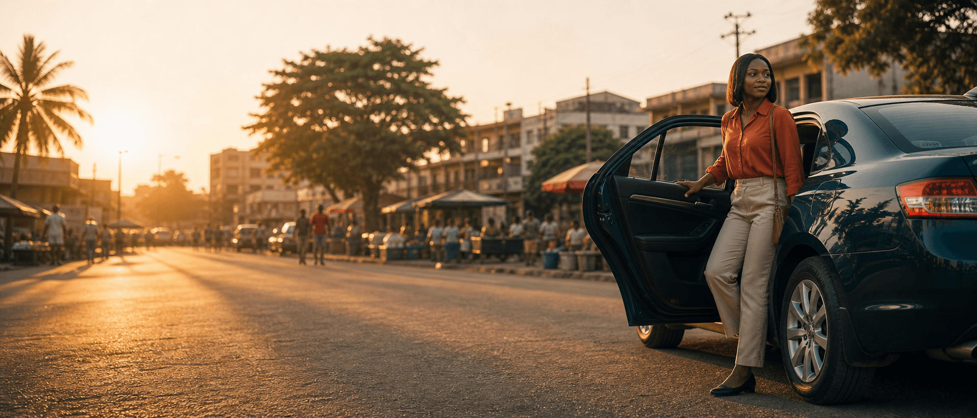 Rider stepping into a clean sedan at golden hour, one hand on the open door
